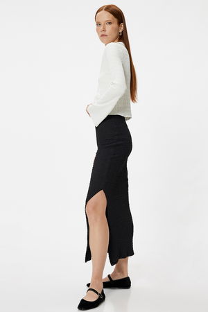 Koton  Midi Boy Yırtmaç Detaylı Slim Fit Dokulu Kalem Etek SİYAH Koton  Midi Boy Yırtmaç Detaylı Slim Fit Dokulu Kalem Etek SİYAH
